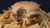 A photo of a partially-eaten McDonalds' Big Mac hamburger atop French fries, November 2, 2010.