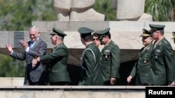U.S. Secretary of Defense James Mattis walks with Brazilian military officers during a visit to the Monument to the Dead of World War II, Rio de Janeiro, Brazil, Aug.14, 2018.
