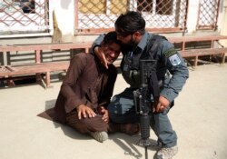 A man cries after an attack in maternity hospital, in Kabul, Afghanistan, May 12, 2020.