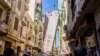 Egyptian police evacuated a 13-floor building in eastern Alex “Azareta” in the early hours of Wednesday morning after it tilted over the opposite building. Sunday, June 4, 2017. (H. Elrasam/VOA)