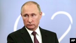 Russian President Vladimir Putin speaks to the media after the G-20 summit in Buenos Aires, Argentina, Dec. 1, 2018. Putin and Trump "said hi to each other," according to the Russian leader's spokesman, but didn't shake hands or otherwise speak.