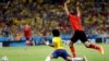 Mexico's Raul Jimenez, right, raises his arms after a challenge on Brazil's Marcelo during the group A World Cup soccer match between Brazil and Mexico at the Arena Castelao in Fortaleza, Brazil, Tuesday, June 17, 2014