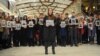 People hold portraits and printed names of victims of the Tu-154 plane, which crashed into the Black Sea on its way to Syria on Sunday, during a memorial event in Rostov-On-Don, Russia, Dec. 26, 2016.