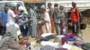 Families queue at a United Nations Human Rights Council (UNHRC) centre for Burundi refugees in Uvira to receive food ration and clothing in South Kivu in the Democratic Republic of Congo (DRC) May 20, 2015.