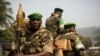 Soldiers from the AU peacekeeping mission prepare to leave at the end of a speech given by Alexandre-Ferdinand Nguendet, the head of Central African Republic's transitional assembly at the Gendarmerie headquarters in Bangui on Jan. 13, 2014. 