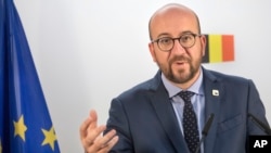FILE - Belgian Prime Minister Charles Michel holds a press conference on the second day of the EU summit in Brussels, Oct. 21, 2016. 