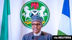 FILE - Nigerian President Muhammadu Buhari addresses the nation on the coronavirus disease (COVID-19), in Abuja, March 29, 2020. (Nigeria presidency/handout)