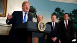 President Donald Trump speaks before signing a presidential memorandum on the imposition of tariffs and investment restrictions on China, in the Diplomatic Reception Room of the White House, March 22, 2018, in Washington.