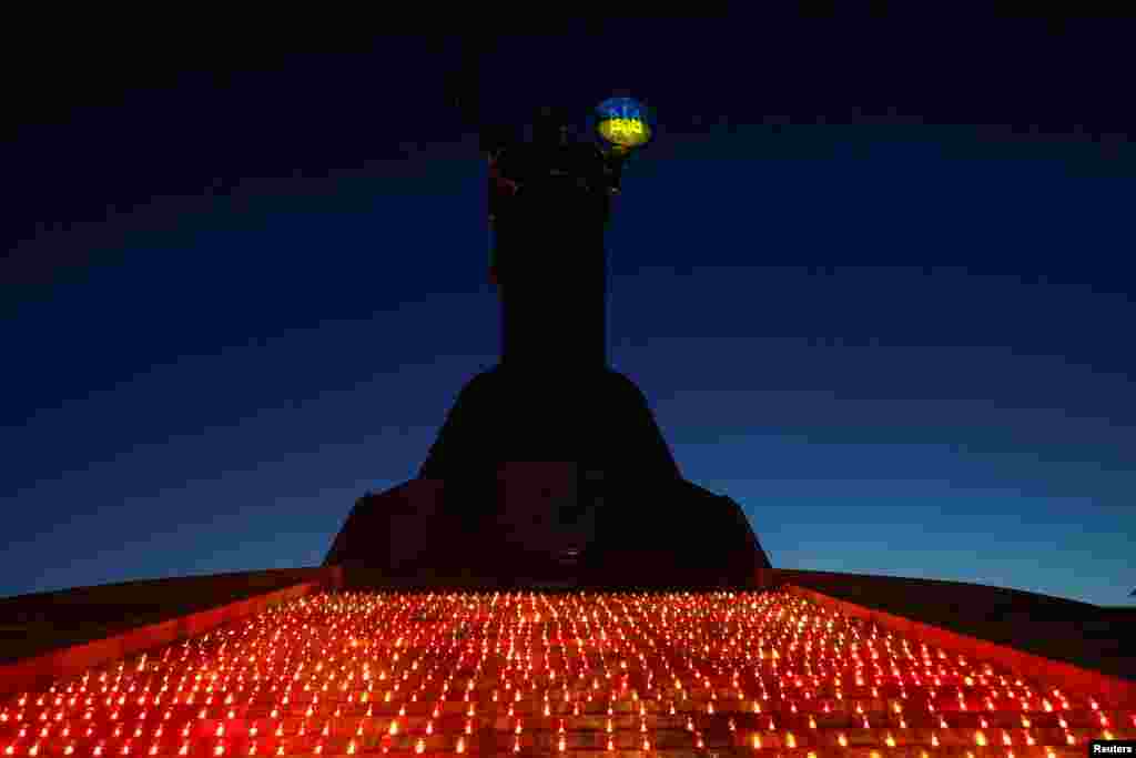 1,000 candles are seen in front of the 'Motherland' monument during a commemorative ceremony on the 1,000th day of Russia's full scale attack on Ukraine, in Kyiv, Ukraine.