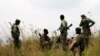 FILE - Soldiers from the Democratic Republic of Congo (DRC) take positions near its border with Rwanda after fighting broke out in eastern Congo, June 12, 2014. 