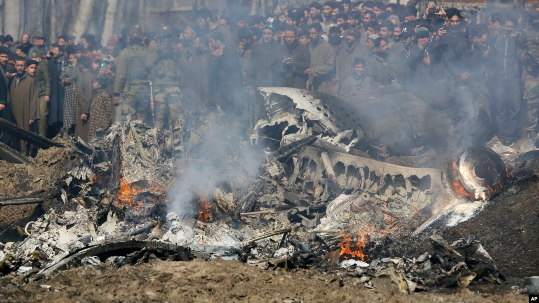 Kashmiri villagers gather near the wreckage of an Indian aircraft after it crashed in Budgam area, outskirts of Srinagar, Indian-controlled Kashmir, Feb. 27, 2019. 