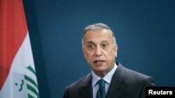 Perdana Menteri Irak Mustafa al-Kadhimi berbicara selama konferensi pers bersama di Berlin, Jerman 20 Oktober 2020. (Foto: Stefanie Loos via REUTERS)