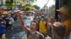 FILE - Anti-coup protesters shout slogans during a demonstration, May 6, 2021, in Yangon, Myanmar.