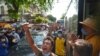 FILE - Anti-coup protesters shout slogans during a demonstration, May 6, 2021, in Yangon, Myanmar.