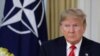 U.S. President Donald Trump grimaces during a meeting with NATO Secretary General, Jens Stoltenberg at Winfield House in London, Tuesday, Dec. 3, 2019.