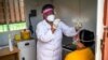 Asnath Masango, gives a patient a COVID-19 test at the Ndlovu clinic in Elandsdoorn, 200 kms north-east of Johannesburg Thursday Feb. 11, 2021. The center is running a study of the Johnson & Johnson COVID-19 vaccine.