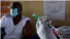 A health worker prepares a dose of the Oxford/AstraZeneca COVID-19 vaccine in Francistown, Botswana, March 26, 2021. (AFP)