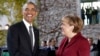 U.S. President Barack Obama, left, is welcomed by German Chancellor Angela Merkel prior to a meeting of the government heads of Germany, France, Italy, Spain and Britain in Berlin, Nov. 18, 2016.
