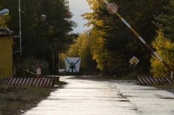 FILE - A view shows an entrance checkpoint of a military garrison near the village of Nyonoksa in Arkhangelsk Region, Russia, Oct. 7, 2018.