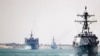 FILE - In this photo provided by the U.S. Navy, the Abraham Lincoln Carrier Strike Group transits the Suez Canal, May 9, 2019. Deployed strike group assets included the Spanish navy's Mendez Nunez frigate.