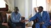 Zimbabwean President Emmerson Mnangagwa, right, talks to Morgan Tsvangirai, the main opposition leader in Zimbabwe, during a visit to his residence in Harare, Jan. 5, 2018.