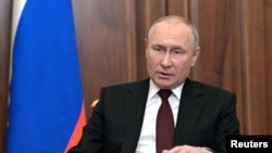 Russian President Vladimir Putin delivers a video address to the nation in Moscow