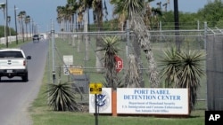 FILE - A U.S. Border Patrol vehicle enters the Port Isabel Detention Center, which holds detainees of U.S. Immigration and Customs Enforcement, June 26, 2018, in Los Fresnos, Texas.