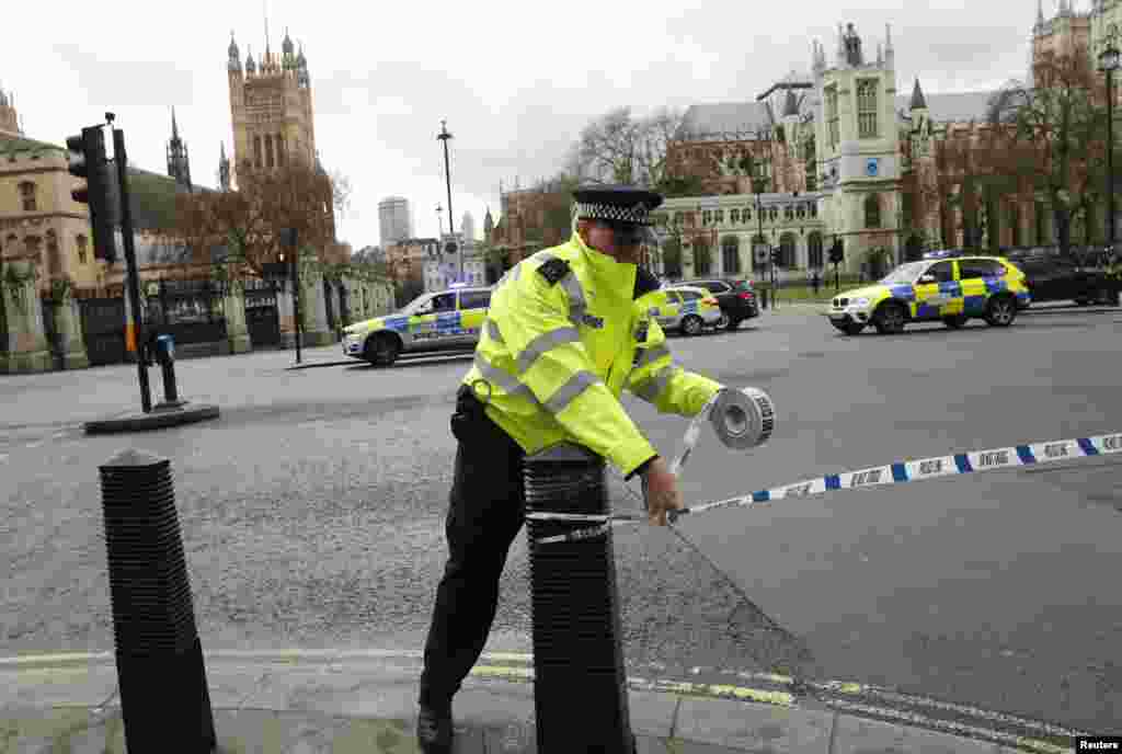 Police tapes off Parliament Square after reports of loud bangs, in London, Britain, March 22, 2017.