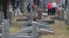 FILE - Local and national media report on more than 170 toppled Jewish headstones after a weekend vandalism attack on Chesed Shel Emeth Cemetery in University City, a suburb of St Louis, Missouri, Feb. 21, 2017. 