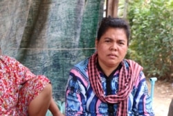 Pann Sopheak, 41, makes a living by selling fruit, in Kien Svay district, Kandal province, Cambodia, April 12, 2020.