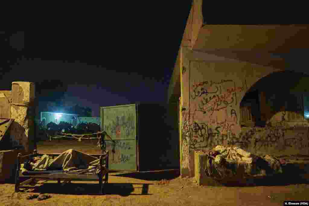 Resting up before the frenzy ahead of the feast. After a trek on foot from as far away as Sudan, camel traders spend the night near the camel pens as they prepare for a busy day of trading.