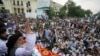 Khadim Hussain Rizvi, leader of Tehrik-e-Labaik Pakistan (TLP) Islamic political party, gestures as he addresses the supporters during a rally to express solidarity with the people of Kashmir, in Lahore, Pakistan, Aug. 9, 2019.