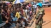 A United Nations peacekeeper watches over crowds that have assembled to greet Pope Francis in Bangui, Central African Republic on, November 29, 2015 (VOA/C. Stein).