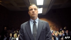 FILE - South African Paralympic sprinter Oscar Pistorius appearing at Magistrate Court in Pretoria.