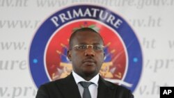 Interim Prime Minister Claude Joseph stand before delivering his speach during the appointment of Ariel Henry as the new Prime Minister in Port-au-Prince, Haiti, July 20, 2021