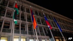 The Palestinian flag is raised in front of the Slovenian parliament building after the vote in Ljubljana, Slovenia, June 4, 2024. Slovenia recognized a Palestinian state on Tuesday after its parliament voted overwhelmingly in favor of the move,