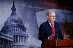 Senate Majority Leader Mitch McConnell of Ky., speaks with reporters after the Senate approved a nearly $500 billion coronavirus aid bill, April 21, 2020, on Capitol Hill in Washington.