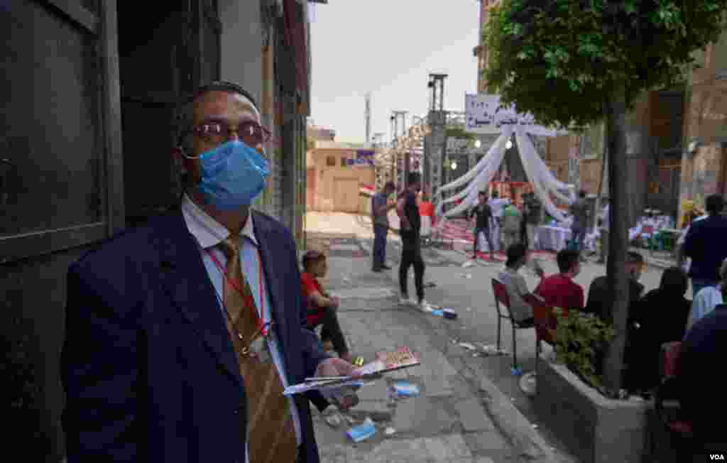 At the polls, lawyer Mostafa Hefny comments on what he expects to be a lackluster turn out of young voters, saying, “Most of them don't understand the role of the senate or how it will benefit them,” in Cairo, Aug. 11, 2020.