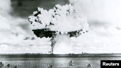 A 63-kiloton nuclear warhead explodes 90 feet under water at Bikini Atoll in July 1946 as part of Operation Crossroads to measure nuclear weapon effects on warships.