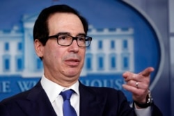 FILE - Treasury Secretary Steven Mnuchin speaks about the coronavirus in the James Brady Press Briefing Room at the White House in Washington.