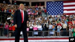 FILE - President Donald Trump arrives to speak at a campaign rally at Erie Insurance Arena, Oct. 10, 2018, in Erie, Pa. 