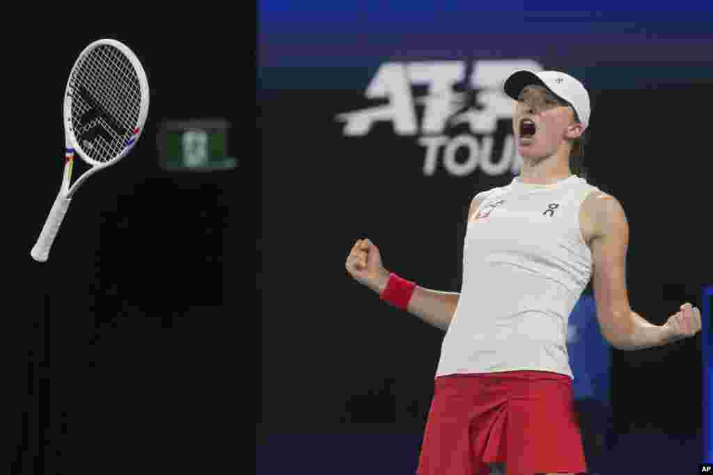 Poland's Iga Swiatek celebrates after defeating Britain's Katie Boulter in their quaterfinal match at the United Cup tennis tournament in Sydney, Australia.