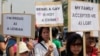 FILE - Indonesian gay activists hold posters during a protest demanding equality for LGBT (Lesbian, gay, bisexual and transgender) people in Jakarta, Indonesia, May 21, 2011.