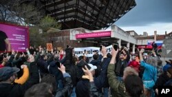 People take part in a protest organized by the Slovakian opposition parties in Bratislava on March 27, 2024, over a plan by the government of populist Prime Minister Robert Fico to take over the public television and radio broadcaster.