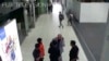 FILE - Kim Jong Nam, exiled half brother of North Korea's leader Kim Jong Un, gestures toward his face while talking to airport security and officials at Kuala Lumpur International Airport, Malaysia, in this image made Feb. 13, 2017, from Kuala Lumpur air