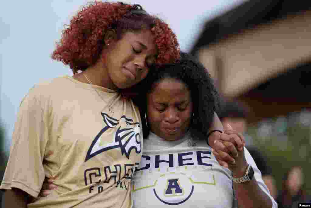 Women cry while attending a vigil at Jug Tavern Park following a shooting at Apalachee High School in Winder, Georgia, Sept. 4, 2024. The student, identified as Colt Gray, opened fire at the school, killing two students and two teachers and wounding nine, law enforcement officials said.