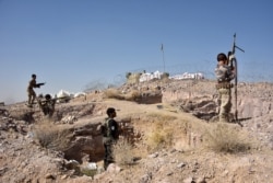 FILE - Security forces take part in an operation against Taliban militants in Arghandad district of Kandahar province, Afghanistan, Nov. 2, 2020.