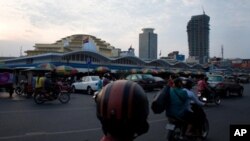 Phnom Penh's skyline is fast seeing new skyscrapers, prompting artists to create works commenting on the rapid urbanization in the city. – Yong YN