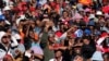 Supporters of South Africa's Economic Freedom Fighters (EFF) listen to their leader Julius Malema during his campaign, ahead of the August 3 local government elections, in Etwatwa, a township near Benoni, South Africa, July 27, 2016. 