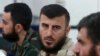 FILE - Zahran Alloush, founder of the Army of Islam, talks during a conference in Douma, Syria, Aug. 27, 2014. Alloush was killed Friday in a Russian airstrike on the his group's headquarters in Eastern Ghouta.